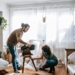 couple wrapping a chair